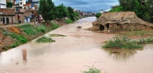 Monsoon flashfloods inundate ailing economy